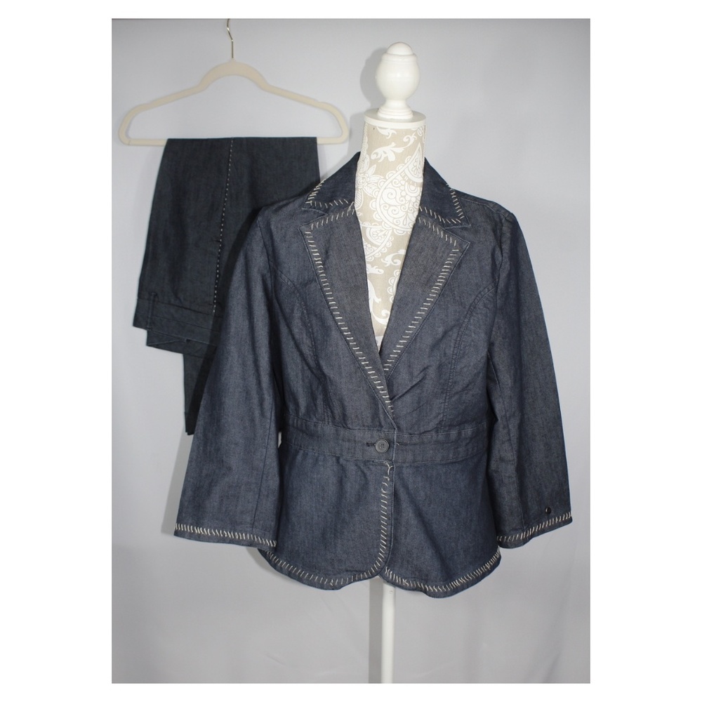 A Denim pant and matching jacket set that has 1 button in the front for closure